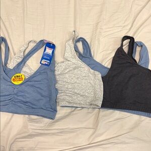 Set of four bralettes in dark grey, light grey, and blue
